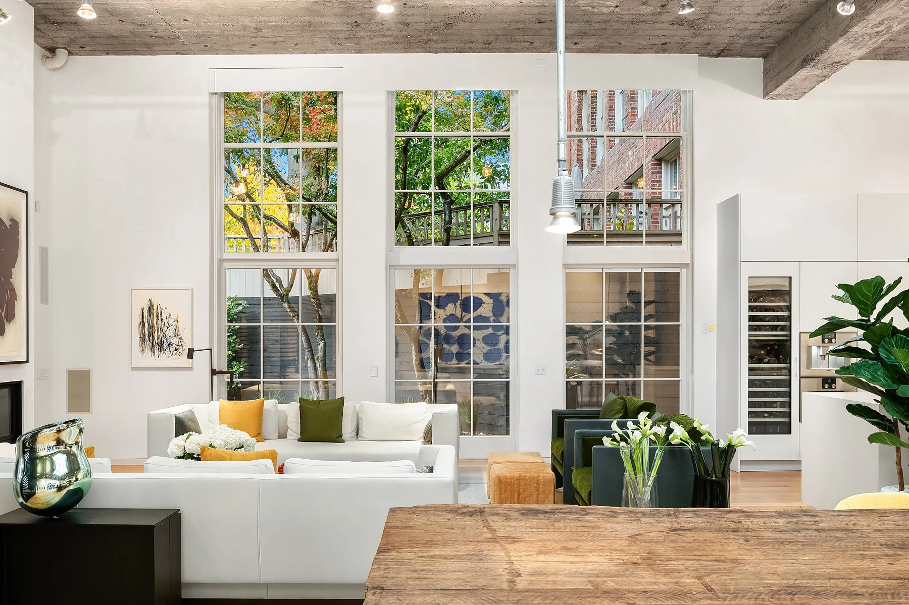 The Gym's open living room beneath its historic concrete ceiling
